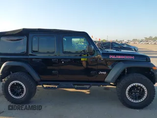 2018 Jeep Wrangler Unlimited Sport S z VIN 1C4HJXDG9JW169478, wystawiony jako IAAI lot #40387425 z przebiegiem 59 287 mil mil oraz . Historia ofert i sprzedaży dostępna na DreamBid. Obrazek 13.