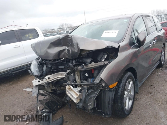 2018 Honda Odyssey EX-L with VIN 5FNRL6H72JB081086, listed as a IAAI auction lot 41031370 with 73,907 mi miles and . Bid and sale history available at DreamBid. Image 6.
