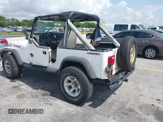 1990 Jeep Wrangler with VIN 2J4FY29T7LJ528844, listed as a IAAI auction lot 42354175 with 69,349 mi miles and . Bid and sale history available at DreamBid. Image 3.