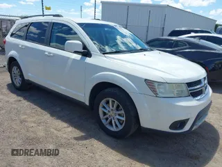 2017 Dodge Journey SXT z VIN 3C4PDDBG7HT512776, wystawiony jako IAAI lot #41967109 z przebiegiem 109 747 mil mil oraz . Historia ofert i sprzedaży dostępna na DreamBid. Obrazek 1.