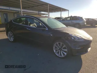 2019 Tesla Model 3 Mid Range with VIN 5YJ3E1EA6KF436152, listed as a Copart auction lot 50399265 with 62,676 mi miles and Salvage Title. Bid and sale history available at DreamBid. Image 4.
