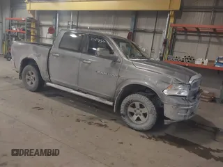 2012 Ram 1500 Outdoorsman z VIN 1C6RD7LT5CS256922, wystawiony jako IAAI lot #41597456 z przebiegiem 103 324 mil mil oraz . Historia ofert i sprzedaży dostępna na DreamBid. Obrazek 1.