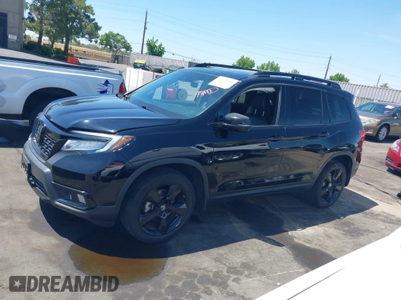 2021 Honda Passport Elite with VIN 5FNYF8H07MB003506, listed as a IAAI auction lot 42571906 with 42,323 mi miles and . Bid and sale history available at DreamBid. Image 15.