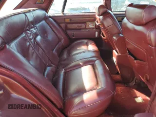 1984 Cadillac Seville z VIN 1G6AS6984EE826325, wystawiony jako Copart lot #77209864 z przebiegiem 26 366 mil mil oraz Tytuł czysty. Historia ofert i sprzedaży dostępna na DreamBid. Obrazek 10.