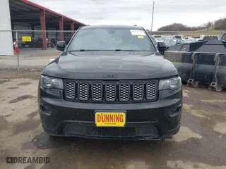 2018 Jeep Grand Cherokee Laredo E with VIN 1C4RJFAG3JC324434, listed as a IAAI auction lot 41812311 with 140,820 mi miles. Bid and sale history available at carsss.com. Image 12.