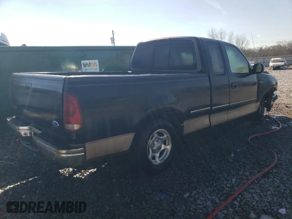 1997 Ford F-150 with VIN 1FTDX1722VNB96527, listed as a Copart auction lot 87304814 with 106,771 mi miles and Salvage title. Bid and sale history available at DreamBid. Image 3.