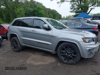 2019 Jeep Grand Cherokee Laredo E with VIN 1C4RJFAG5KC567003, listed as a IAAI auction lot 42390239 with 82,505 mi miles and . Bid and sale history available at DreamBid. Image 13.
