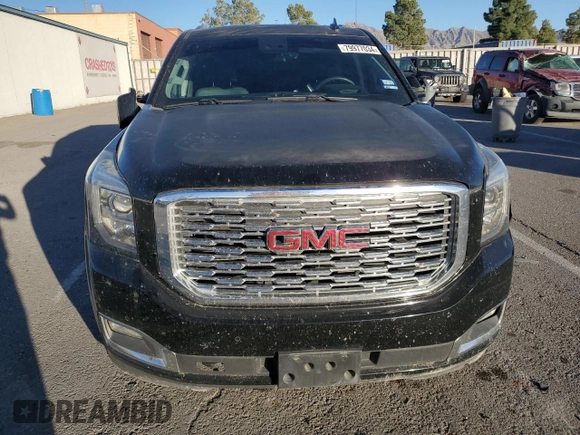2018 GMC Yukon Denali with VIN 1GKS1CKJ0JR106589, listed as a Copart auction lot 79977034 with 98,022 mi miles and Salvage Title. Bid and sale history available at carsss.com. Image 5.