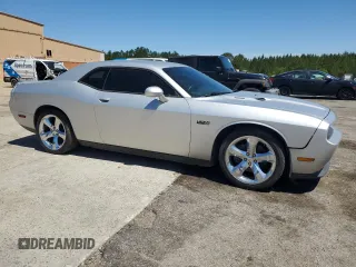 2012 Dodge Challenger R/T z VIN 2C3CDYBT0CH259731, wystawiony jako Copart lot #58033035 z przebiegiem 142 427 mil mil oraz Czysty tytuł • Clean title. Historia ofert i sprzedaży dostępna na DreamBid. Obrazek 4.