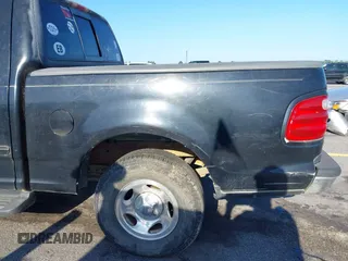 2001 Ford F-150 XLT z VIN 1FTRW07L61KC53030, wystawiony jako IAAI lot #42526499 z przebiegiem 121 675 mil mil oraz . Historia ofert i sprzedaży dostępna na DreamBid. Obrazek 16.