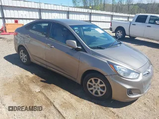2014 Hyundai Accent GLS with VIN KMHCT4AE3EU671681, listed as a IAAI auction lot 41849423 with 208,710 mi miles. Bid and sale history available at carsss.com. Image 1.