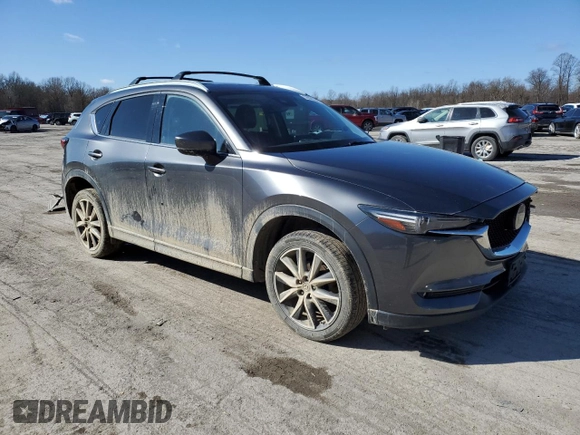 2018 Mazda CX-5 Grand Touring with VIN JM3KFBDM2J0407164, listed as a Copart auction lot 50080345 with 126,464 mi miles and Salvage title. Bid and sale history available at DreamBid. Image 4.