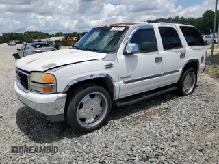 2004 GMC Yukon SLE z VIN 1GKEC13Z04J153396, wystawiony jako Copart lot #64845454 z przebiegiem 245 913 mil mil oraz Czysty tytuł • Clean title. Historia ofert i sprzedaży dostępna na DreamBid. Obrazek 1.