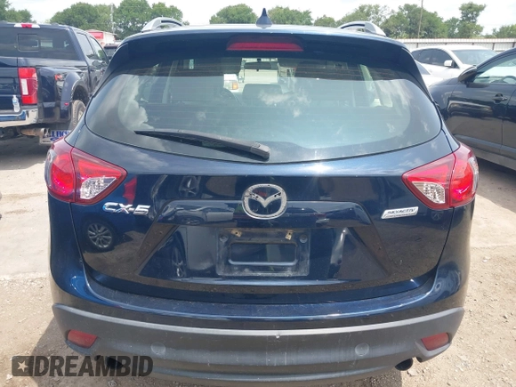 2016 Mazda CX-5 Sport z VIN JM3KE2BY0G0633611, wystawiony jako IAAI lot #42390654 z przebiegiem Nie podano mil oraz . Historia ofert i sprzedaży dostępna na DreamBid. Obrazek 17.
