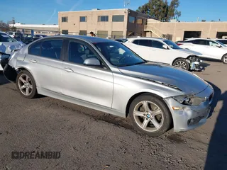 2013 BMW 3 Series 320i with VIN WBA3B1C53DK129703, listed as a IAAI auction lot 41295234 with 175,506 mi miles. Bid and sale history available at carsss.com. Image 1.