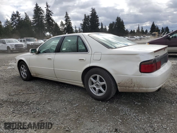 2000 Cadillac Seville Touring STS z VIN 1G6KY5497YU191639, wystawiony jako Copart lot #49658115 z przebiegiem 82 725 mil mil oraz Szkoda całkowita • Salvage title. Historia ofert i sprzedaży dostępna na DreamBid. Obrazek 2.