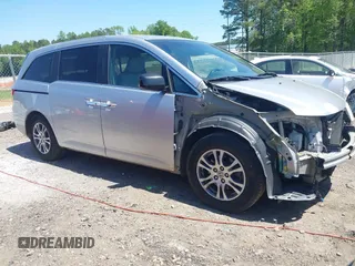 2011 Honda Odyssey EX-L with VIN 5FNRL5H6XBB104990, listed as a IAAI auction lot 42051353 with 207,867 mi miles and . Bid and sale history available at carsss.com. Image 1.
