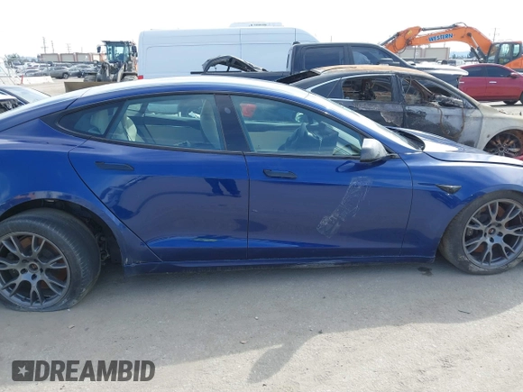 2021 Tesla Model S Long Range with VIN 5YJSA1E51MF442874, listed as a IAAI auction lot 39406495 with 36,127 mi miles and . Bid and sale history available at DreamBid. Image 14.