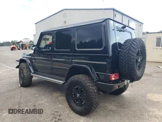 2014 Mercedes-Benz G-Class G 550 with VIN WDCYC3HF2EX214663, listed as a Copart auction lot 62703594 with 104,644 mi miles and Salvage Title. Bid and sale history available at carsss.com. Image 2.