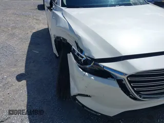 2022 Mazda CX-9 Touring z VIN JM3TCBCY7N0600787, wystawiony jako IAAI lot #42240512 z przebiegiem 27 927 mil mil oraz . Historia ofert i sprzedaży dostępna na DreamBid. Obrazek 6.