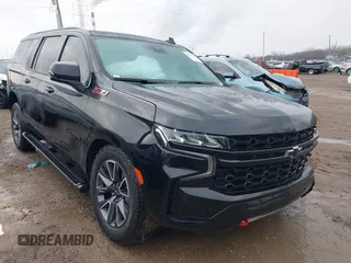 2023 Chevrolet Suburban z VIN 1GNSKDKLXPR396372, wystawiony jako IAAI lot #41143008 z przebiegiem 28 032 mil mil oraz . Historia ofert i sprzedaży dostępna na DreamBid. Obrazek 1.