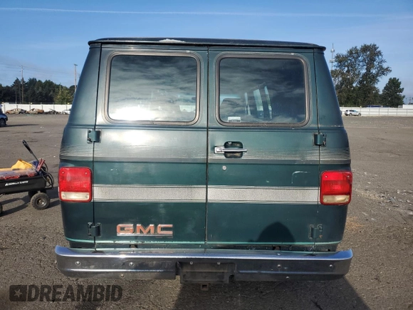 1991 GMC Vandura z VIN 1GDEG25K6M7504729, wystawiony jako Copart lot #71146614 z przebiegiem 181 800 mil mil oraz Tytuł czysty. Historia ofert i sprzedaży dostępna na DreamBid. Obrazek 6.