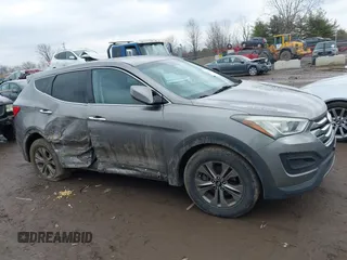 2016 Hyundai Santa Fe z VIN 5XYZTDLB1GG343763, wystawiony jako IAAI lot #41659641 z przebiegiem 96 415 mil mil oraz . Historia ofert i sprzedaży dostępna na DreamBid. Obrazek 13.