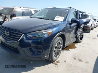2016 Mazda CX-5 Grand Touring z VIN JM3KE2DY3G0797321, wystawiony jako IAAI lot #42017174 z przebiegiem 65 505 mil mil oraz . Historia ofert i sprzedaży dostępna na DreamBid. Obrazek 17.