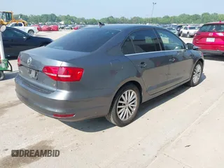 2015 Volkswagen Jetta SE with VIN 3VWD07AJ2FM310154, listed as a IAAI auction lot 42456136 with 96,979 mi miles and . Bid and sale history available at DreamBid. Image 4.