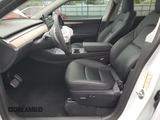 2023 Tesla Model Y Long Range with VIN 7SAYGDEEXPF744472, listed as a Copart auction lot 54109315 with 15,404 mi miles and Salvage Title. Bid and sale history available at DreamBid. Image 7.