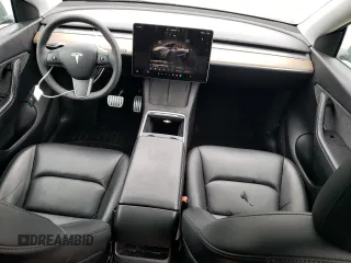 2022 Tesla Model Y Performance with VIN 7SAYGDEF2NF459268, listed as a Copart auction lot 45764735 with 64,421 mi miles and Salvage title. Bid and sale history available at DreamBid. Image 8.