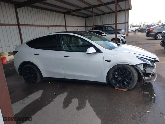 2023 Tesla Model Y Long Range with VIN 7SAYGAEE0PF787216, listed as a IAAI auction lot 41589954 with 17,985 mi miles. Bid and sale history available at carsss.com. Image 14.