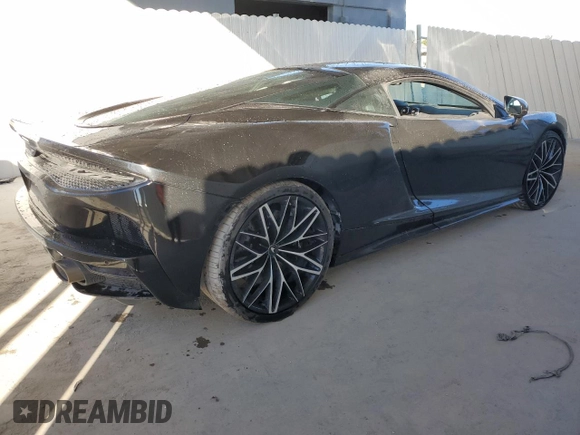2022 McLaren GT z VIN SBM22GCA4NW001602, wystawiony jako Copart lot #83270334 z przebiegiem 33 668 mil mil oraz Tytuł czysty. Historia ofert i sprzedaży dostępna na DreamBid. Obrazek 3.