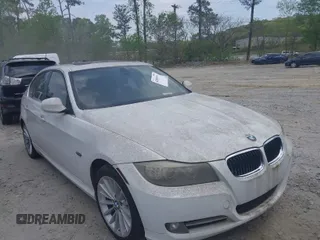2011 BMW 3 Series 335i with VIN WBAPM5C51BE575704, listed as a IAAI auction lot 42005354 with 205,263 mi miles. Bid and sale history available at carsss.com. Image 1.