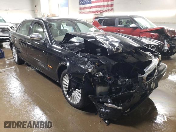 2005 Jaguar XJ Vanden Plas z VIN SAJWA82C65SG44373, wystawiony jako Copart lot #84091444 z przebiegiem 141 993 mil mil oraz Szkoda całkowita • Salvage title. Historia ofert i sprzedaży dostępna na DreamBid. Obrazek 4.