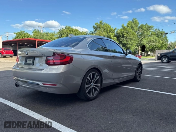 2015 BMW 2 Series 228i with VIN WBA1F5C59FV257027, listed as a Copart auction lot 62222855 with 113,383 mi miles and Clean title. Bid and sale history available at DreamBid. Image 4.