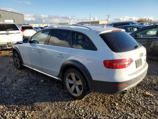 2016 Audi allroad Premium Plus with VIN WA1UFAFL9GA015036, listed as a Copart auction lot 82052924 with 98,625 mi miles and Salvage Title. Bid and sale history available at carsss.com. Image 2.
