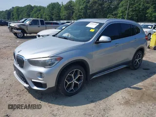 2018 BMW X1 xDrive28i with VIN WBXHT3C39J5L27926, listed as a IAAI auction lot 42582330 with 101,197 mi miles and . Bid and sale history available at DreamBid. Image 2.