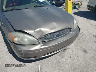 2006 Ford Taurus SE with VIN 1FAFP53U96A223924, listed as a IAAI auction lot 41828443 with 114,653 mi miles. Bid and sale history available at carsss.com. Image 13.