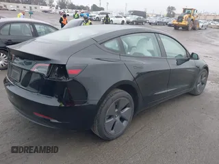 2023 Tesla Model 3 with VIN 5YJ3E1EA0PF587656, listed as a IAAI auction lot 41489586 with 12,844 mi miles and . Bid and sale history available at DreamBid. Image 4.