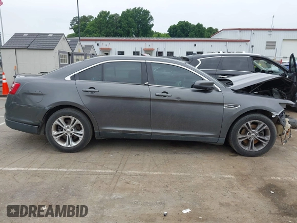 2015 Ford Taurus SEL z VIN 1FAHP2E81FG163058, wystawiony jako IAAI lot #42279778 z przebiegiem 127 957 mil mil oraz . Historia ofert i sprzedaży dostępna na DreamBid. Obrazek 13.