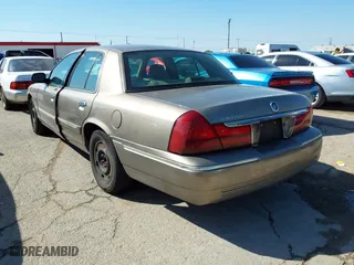 2003 Mercury Grand Marquis GS Convenience with VIN 2MEFM74W43X662724, listed as a IAAI auction lot 42036847 with 234,008 mi miles. Bid and sale history available at carsss.com. Image 3.