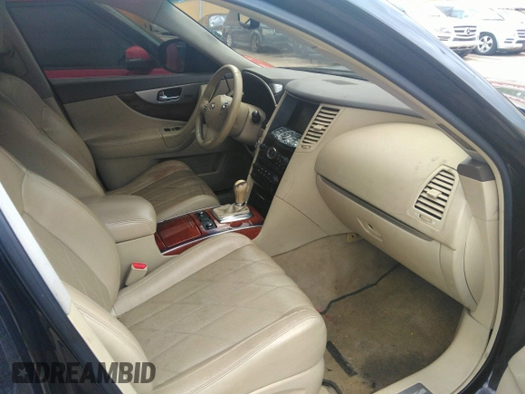 2012 Infiniti FX with VIN JN8AS1MU1CM121512, listed as a IAAI auction lot 42201447 with 285,357 mi miles. Bid and sale history available at carsss.com. Image 5.