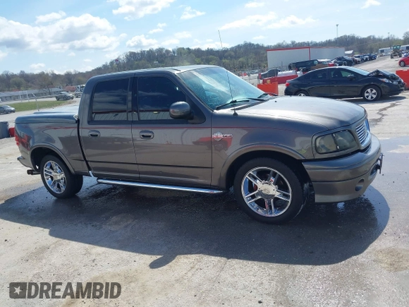 2002 Ford F-150 Harley Davidson with VIN 1FTRW07392KE11409, listed as a IAAI auction lot 41877998 with 148,476 mi miles. Bid and sale history available at carsss.com. Image 13.