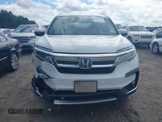 2020 Honda Pilot Elite with VIN 5FNYF6H08LB014288, listed as a IAAI auction lot 40496871 with 57,921 mi miles and . Bid and sale history available at DreamBid. Image 12.