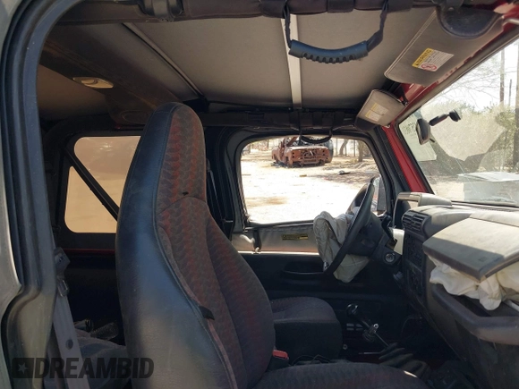 2000 Jeep Wrangler Sport with VIN 1J4FA49S0YP731544, listed as a IAAI auction lot 42570831 with Not provided miles and . Bid and sale history available at DreamBid. Image 8.