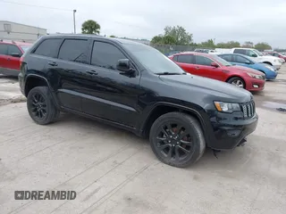2018 Jeep Grand Cherokee Laredo E with VIN 1C4RJFAG7JC312948, listed as a IAAI auction lot 41624027 with 116,763 mi miles. Bid and sale history available at carsss.com. Image 1.