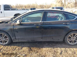 2020 Ford Fusion Hybrid Titanium with VIN 3FA6P0RU9LR141476, listed as a IAAI auction lot 41472921 with 84,433 mi miles. Bid and sale history available at carsss.com. Image 15.