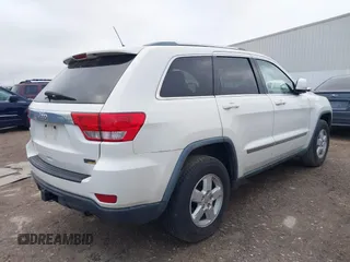 2012 Jeep Grand Cherokee Laredo with VIN 1C4RJFAG5CC224032, listed as a IAAI auction lot 42069334 with 106,614 mi miles. Bid and sale history available at carsss.com. Image 4.