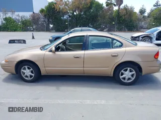 1999 Oldsmobile Alero GL z VIN 1G3NL52T1XC384073, wystawiony jako IAAI lot #42359330 z przebiegiem 177 869 mil mil oraz . Historia ofert i sprzedaży dostępna na DreamBid. Obrazek 14.